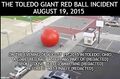 Alarmo-Gram NewsGlyph™ of the 2015 Toledo Giant Red Ball rolling down the street in Toledo, Ohio on August 19, 2015.