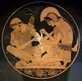 Achilles tending Patroclus wounded by an arrow, identified by inscriptions on the upper part of the vase. Tondo of an Attic red-figure kylix, ca. 500 BC. From Vulci.