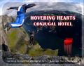 Two BASE jumpers fly-falling to a tryst on a Hovering Hearts Conjugal Hotel flying heart bed.