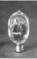 1901: Miniaturized version of John Ambrose Fleming delivers lecture from within Fleming tube.