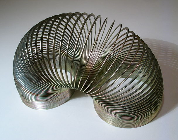Slinky, a well-known variety of spring. Slinky stores mechanical energy, and then releases it in the for form of fun.