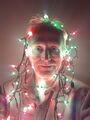 2019: Self-portrait wearing red and green Christmas lights.