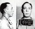 1950: Novelist and screenwriter Dalton Trumbo is photographed Bureau of Prisons authorities. Trumbo will serve eleven months in the federal penitentiary in Ashland, Wisconsin for refusing to testify before House Un-American Activities Committee.
