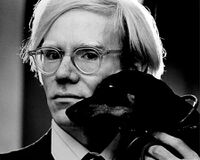 Andy Warhol poses for picture, leaves the viewer to form their own opinion.