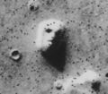 Satellite photo of a mesa in the Cydonia region of Mars, often called the "Face on Mars" is a classic example of pareidolia. High-resolution photos from multiple viewpoints demonstrate that the "face" is in fact a natural rock formation.