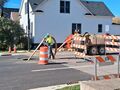 Road repair (8 October 2025) @ 12:57 p.m. Central Avenue at Harvey Street, preparing to install manhole cover.